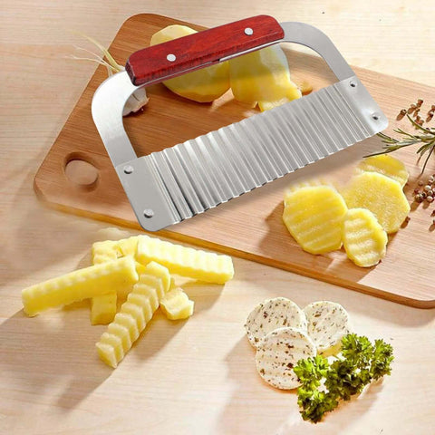 Angled front view of Zorveiio stainless steel crinkle cutter with wooden handle on cutting board; ridged wavy blade.