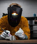 Welder using Hobart helmet with Helmet Mounted LED Welding Light Attachment for Inventor, Creator and Pillar Series Weld Helmets