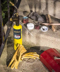 Trigger Start Butane Torch for Soldering and Welding with MAP PRO gas, tools, and gloves on a concrete step in a DIY setup