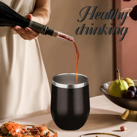 12oz Double Wall Vacuum Insulated Stemless Wine Tumbler With Straw And Lid Stainless Steel Cup Keeps Drinks Ice Cold Or Piping Hot All Day Perfect For Backyard Hangs And Weekend Sippin Vibes in black pouring red wine.