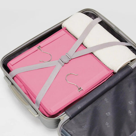 Hanging Closet Organizer With Bamboo Inserts And MDF Tops Pink in suitcase for travel, compact storage view.