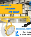Tough As Nails 30W LED Loading Dock Light With 43 Inch Swivel Arm 3300 Lumen mounted on yellow arm in an industrial warehouse.