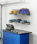 Heavyweight Garage Storage Hooks Built Like Tanks Featuring Scratch Resistant Rubber Sleeves For Rust Free Workshop Wall Tool Organization And Shop Rig Setup with tools and storage bins on shelves.