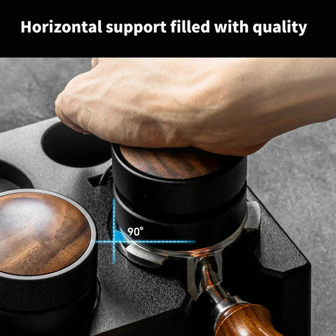 Hand placing portafilter on Slick Coffee Tamper Holder Portafilter Stand Tight Tamping Station Organizer for Home Baristas.