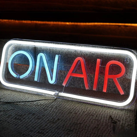 Live On Air Neon Sign For Streamers And Gamers USB Powered LED Studio Decor Lights glowing in blue and red on a grey surface.
