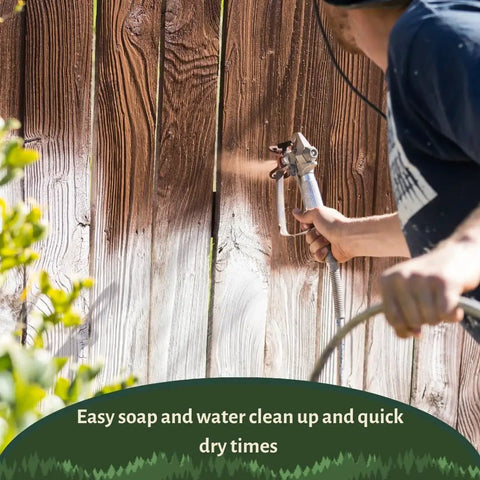 Man spraying Top Shelf Penetrating Exterior Wood Stain In Acorn Brown 5 Gallon on wooden fence with a sprayer.