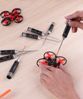 Pro RC Hex Driver Set 7Pc Hex Allen Screwdriver Kit used to repair small drone on a wooden table