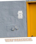 Ultimate Weatherproof Plastic Electrical Junction Box For Outdoor Use With Sturdy Wiring And Easy Install mounted on a gray wall.