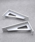 Top Notch 2 Pack Wall Mounted Shelf Brackets Heavy Duty Metal Triangle Supports Built Tough For Wood Boards Quick Install Includes Full Hardware White Finish, showing white iron brackets.