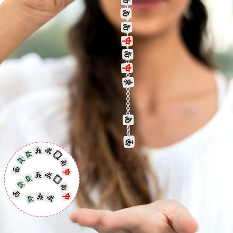 Woman holding a string of 100 Pcs Mahjong Beads For Jewelry Making With Pre Drilled Holes Charms, polymer clay tiles in assorted colors.