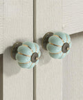 Close-up of installed sky blue ceramic pumpkin knobs from 5 Pack Retro Vintage Ceramic Pumpkin Cabinet Knobs Set For Kitchen Cabinets Drawers.