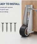 Heavy Duty Bottom Guide Roller Wheel For Barn And Closet Doors Quiet Soft Rubber Caster mounted on wood with installation screws.