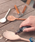 Drop Dead Easy Multi Chuck For Rotary Tools Quick Installation Rock Solid Grip Holds 0.8 To 3.2 Millimeter Shafts Hassle Free Accessory Adapter For Woodworking And DIY Crafts in use on wooden spoon.