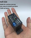 No Fuss AC Current Sensing Relay With 0 To 30 Amp Range featuring Normally Closed Contacts in a technician's hand.