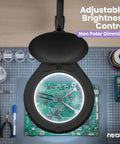 Pro Grade LED Magnifying Lamp With Clamp, 6 Inch Glass Lens, illuminating a circuit board, showcasing nonpolar dimming feature.