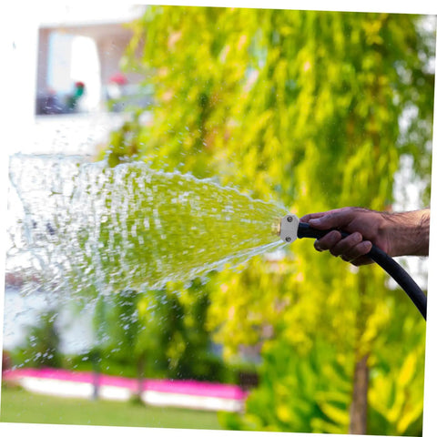 Grab This Top Pick Rustproof Garden Hose Repair Kit Featuring Three Heavy Duty Aluminum Alloy Connectors That Stand Up To High Pressure For Drip Free Outdoor Watering And Car Washing Tasks Today, hand holding hose connector spraying water