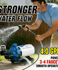 Man using On Demand 110V RV Water Pump Diaphragm, 4 GPM 50 PSI Fresh Water Pump With Pressure Switch to water garden