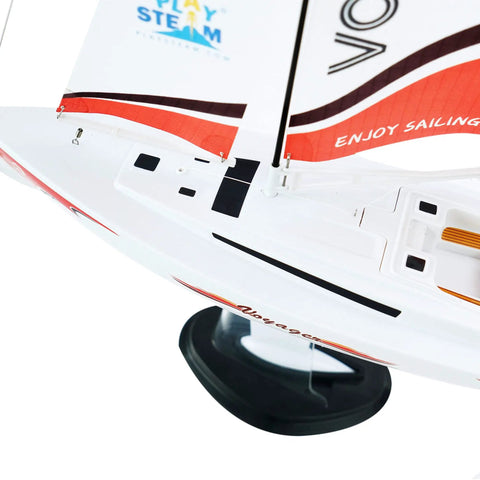 Close-up view of Voyager 280 Wind Powered RC Sailboat in red with two channel control water rudder, no motor required