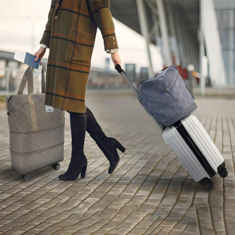 Drvoon expandable luggage set: gray checkered duffel on wheels and blue checkered carry-on atop a white roller suitcase.