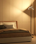 Bedroom scene with Rotatable LED Floor Lamp with Touch and Remote Control, 3000K–6000K Dimmable 22W, black, beside modern bed.