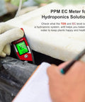 Hand using Hydroponics 4 In 1 pH Meter EC TDS Temperature Tester for Home Growers Digital pH Up Down Tester