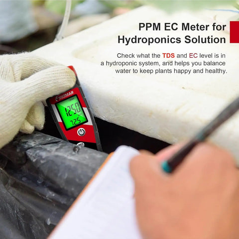 Hand using Hydroponics 4 In 1 pH Meter EC TDS Temperature Tester for Home Growers Digital pH Up Down Tester