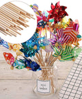 Top Tier 100 Piece 1/8 By 6 Inch Wooden Dowel Rods Smooth Bamboo Craft Sticks Bulk DIY Staple for cake decorating in a vase.