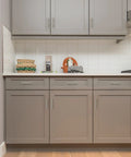Modern kitchen with 60 Pack 5 Inch Cabinet Pulls Brushed Nickel Stainless Steel Kitchen Cupboard Handles on grey cabinets.