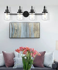Four Light Black Vanity Light Fixtures With Clear Glass Shades Dope Industrial Wall Sconces For Bathroom Hallway Kitchen Living Room Modern Rustic Indoor Lighting mounted above a living room sofa