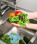 Person washing vegetables in sink with 7 Pack Includes 3 Clog Removers And 4 Silicone Hair Catchers For Shower And Bathroom Drains visible