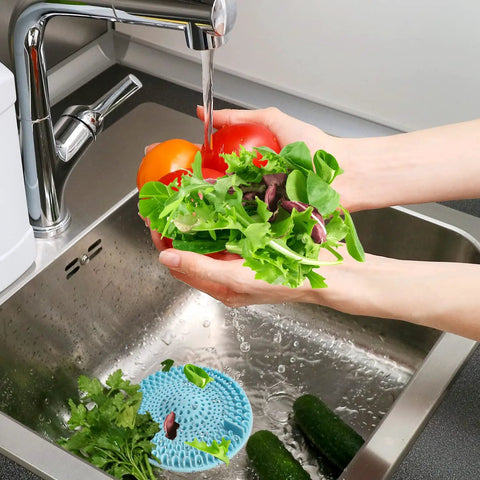 Person washing vegetables in sink with 7 Pack Includes 3 Clog Removers And 4 Silicone Hair Catchers For Shower And Bathroom Drains visible