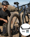Post Mount Disc Brake Adapter Kit For Front 180mm Rear 160mm Conversion Caliper Mount Spacers For MTB And Road Bikes Easy Plug And Play Brake Upgrade Today with cyclist and mountain bike in background