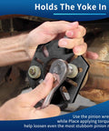 GEAROLL stainless steel pinion yoke wrench tool in front view, used with a ratchet on a black slotted mounting plate to loosen pinion nuts.