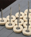 Pro Grade Wool Felt Polishing Wheel Kit 60 Pcs 25mm Buffing Wheels with 3mm shank neatly arranged on gray surface.