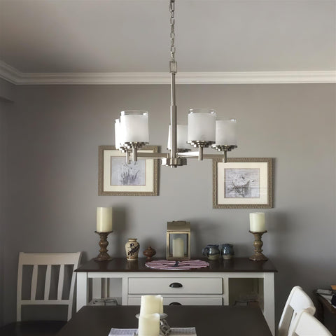 Modern Farmhouse 19 Inch 5 Light Chandelier In Brushed Nickel Finish With Frosted White Linen Glass Shades in dining room setting