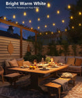 Outdoor Globe String Lights For Patio And Backyard With 50 Hanging Sockets lighting a cozy outdoor dining setup.