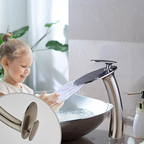 Chrome Waterfall Bathroom Faucet With Single Handle Vessel Sink Brass Lavatory Tap tall slanted body shown in use.