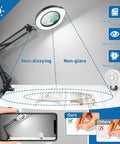 Hands Free Magnifying Lamp With Light And Stand, 15X/30X on desk, showing non-glare feature, LED light and memory function.