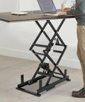 Heavy Duty Electric Scissor Lift Table Rises Smooth With Hydraulic Pump For Factory Work And Warehouse Lifting Up To 140 Pounds Of Steel Goods Or Equipment Effortlessly Today in use at a workspace.