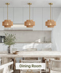 Downright Stunning Handwoven Rattan Pendant Light That Definitely Gives A Super Chill Boho Vibe And Lets Smooth Ambient Lighting Warm Up Your Cozy Kitchen Island in a dining room setting.