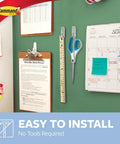 Medium Clear Wire Toggle Hooks With Adhesive Strips Set Of 6 Hooks And 8 Strips For Damage Free Hangin On Walls, Doors, Cabinets Or Closets Holds Up To 2 Lbs Easy No Tools Needed Great For Quick Organization And Storage, shown in use organizing calendars and tools on green board