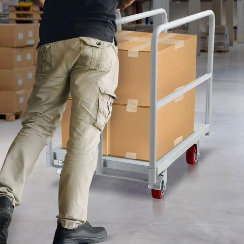 Person using Heavy Duty Steel Panel Cart In Light Gray Offers Rust Resistant Powder Coating And Smooth Rolling Nylon Casters For Garage Or Warehouse Material Handling Built Legit Tough For The Daily Grind with boxes.