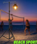 Adjustable Telescopic Lantern Tripod Stand For Camping And Outdoors, Height Range 28.5 Inches To 82.7 Inches on beach at sunset