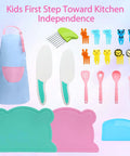 Front view of kids' kitchen set: blue apron with pink pocket, teal-handled knives, utensils, animal clips, and mats.
