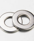 Two stainless steel washers from SAE Flat Washer Set 550 Piece Stainless Steel Assortment For Screws And Bolts In Twelve Sizes Ranging From Two