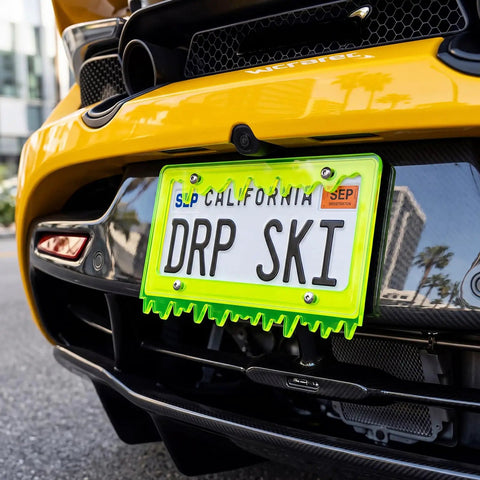 Glow In The Dark Dope Fluorescent Green Acrylic License Plate Frame With Screws Fits Standard 6x12 Inch Car Plates on yellow car