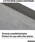 Close-up view of 3.2 mm thick carbon steel blade showing unpolished spine, part of the Carbon Steel Fixed Blade Bushcraft Knife With Sheath.