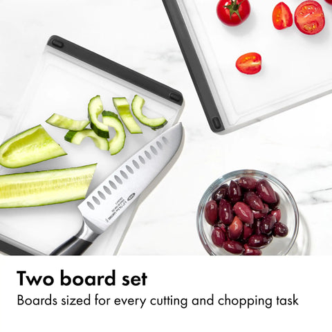 Two Piece Cutting Board Set For Kitchen Prep with tomatoes, cucumbers, and olives on non-porous boards with knife