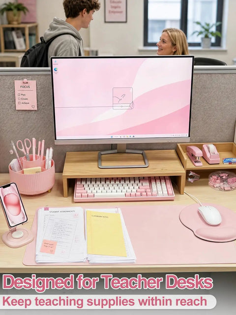 Nine Piece Cute Pink Desk Accessories Set For Women with rotating pen holder, mouse pad, and phone stand on teacher desk