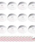 Top Shelf Smoke Detectors With Ten Year Sealed Lithium Battery Deliver Zero Sweat Home Protection And Foolproof Fire Alert Coverage In A Rock Solid Twelve Pack Bundle For Total Peace Of Mind At Home, shown in a twelve pack arrangement with adhesive mounting discs.